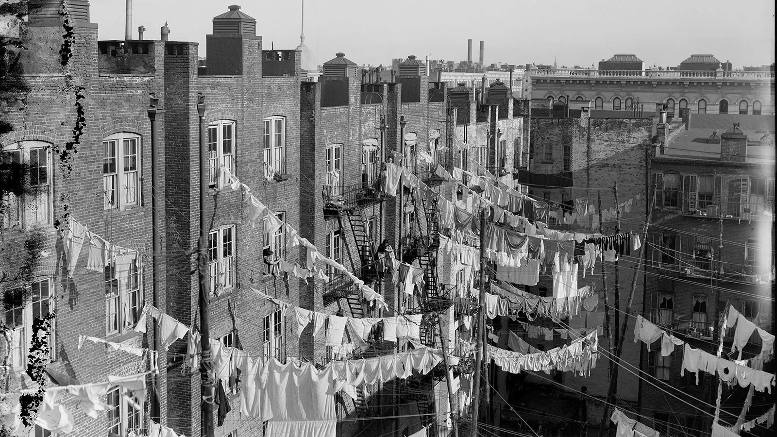 Laundry dries between tenement buildings